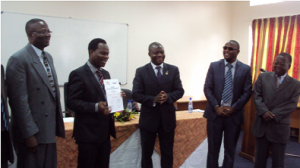 Dr Cosmo Ngongondo shows off his award as Minster of Education, Science and Technology, Hon. Dr. Lucious Kanyumba, Director General of NCST Mr Anthony Muyepa, Principal of Chancellor College Dr Chris Kamlongera and Pro Vice Chancellor Prof Al Mtenje look on